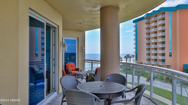 balcony featuring a water view