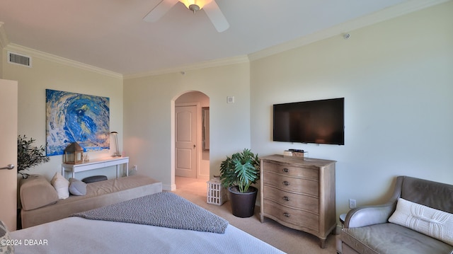 bedroom with ceiling fan, light carpet, and ornamental molding