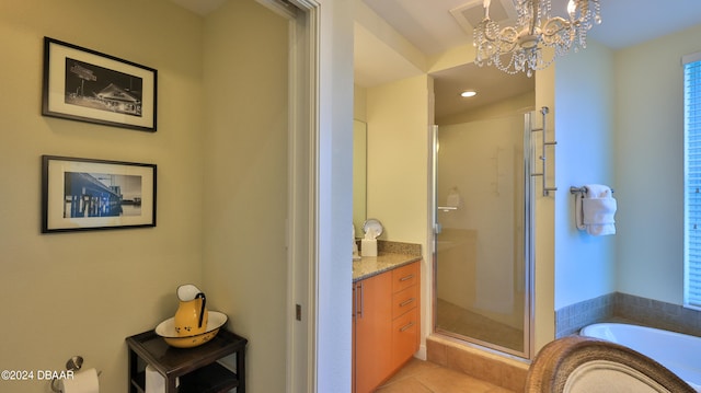 bathroom with vanity, shower with separate bathtub, tile patterned flooring, and a notable chandelier