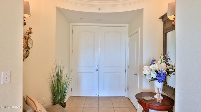 entryway with light tile patterned floors