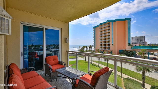 balcony featuring a water view