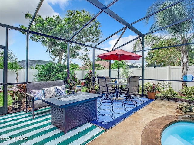 view of patio / terrace featuring a lanai, a fenced backyard, and an outdoor hangout area