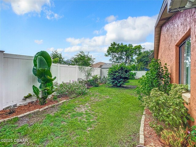 view of yard with a fenced backyard