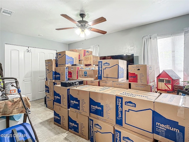 storage area with visible vents and a ceiling fan