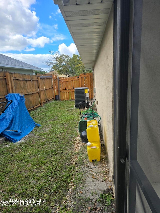 view of yard featuring central AC unit