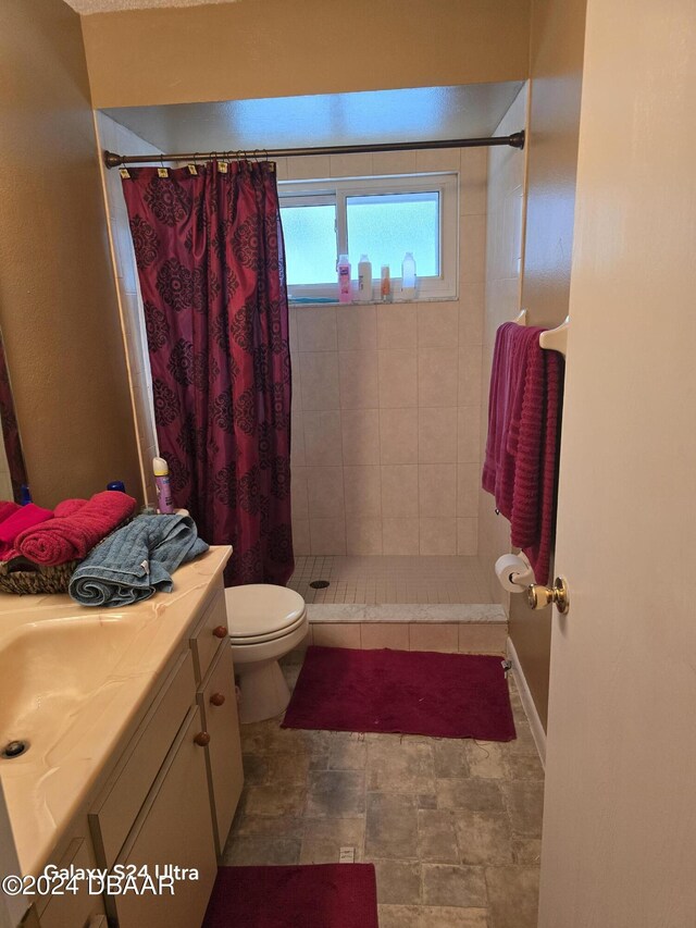 1461 Felton St, Deltona, FL 32725 - full bathroom featuring a tile shower, vanity, and toilet