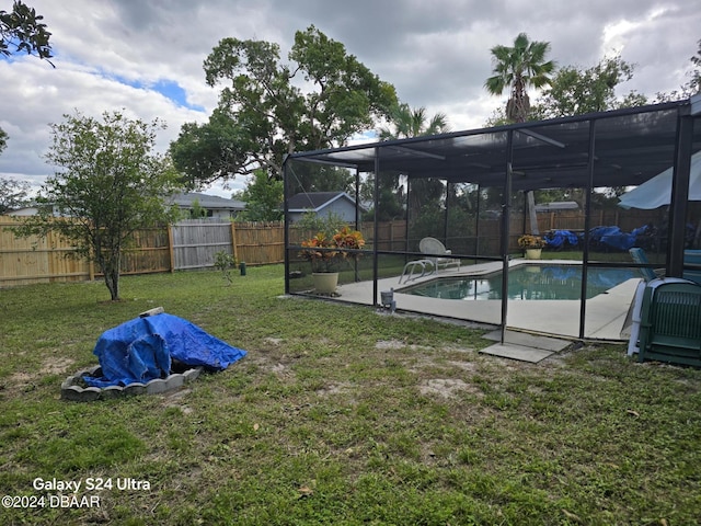 1461 Felton St, Deltona, FL 32725 - view of yard with glass enclosure and a patio