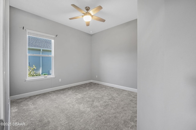 empty room with baseboards, carpet floors, and a ceiling fan