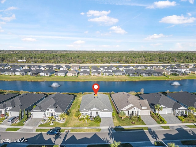 bird's eye view with a residential view and a water view