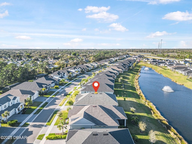 aerial view featuring a residential view and a water view