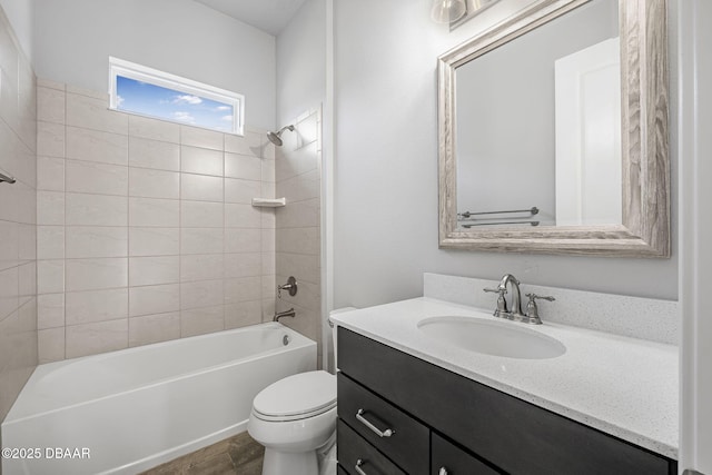 bathroom with vanity, toilet, and washtub / shower combination