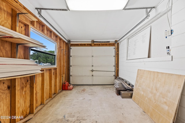 garage featuring wooden walls