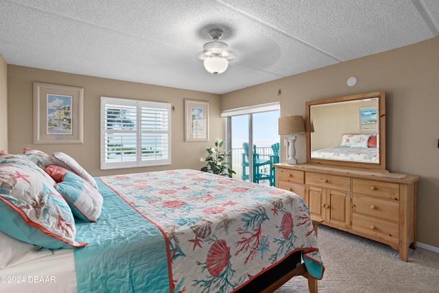 bedroom featuring light carpet, access to outside, multiple windows, and ceiling fan