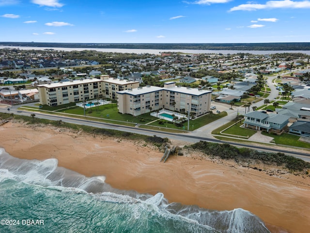 aerial view featuring a water view and a beach view