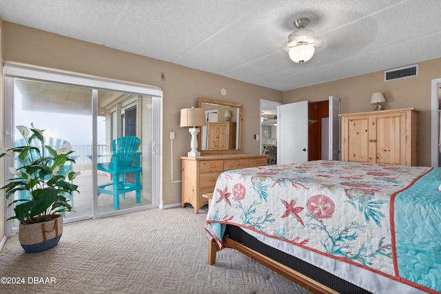 bedroom featuring access to exterior, carpet, a textured ceiling, and ceiling fan