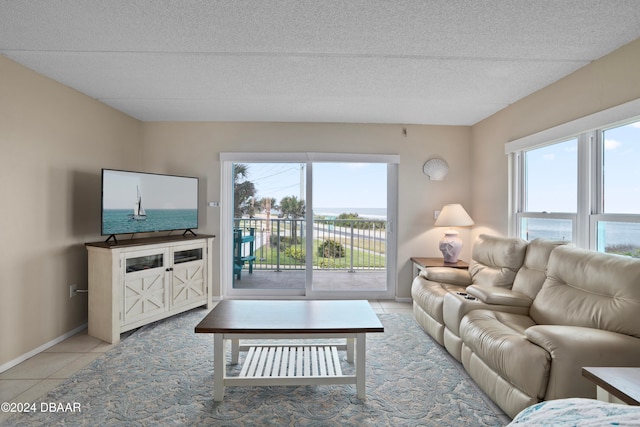 living room featuring a wealth of natural light and light tile patterned floors