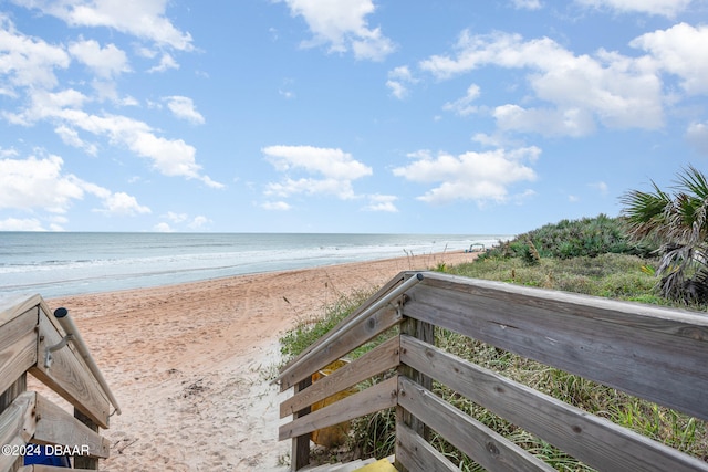 view of community with a view of the beach and a water view