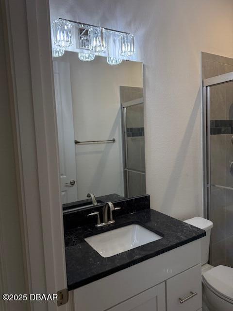 437 Aquamarine Way, Daytona Beach, FL 32124 - bathroom with vanity, a stall shower, and a chandelier