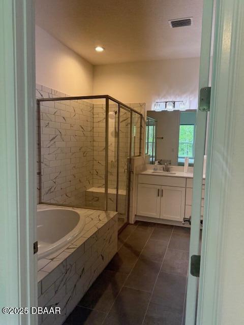 437 Aquamarine Way, Daytona Beach, FL 32124 - full bathroom with tile patterned floors, a bath, vanity, a stall shower, and recessed lighting