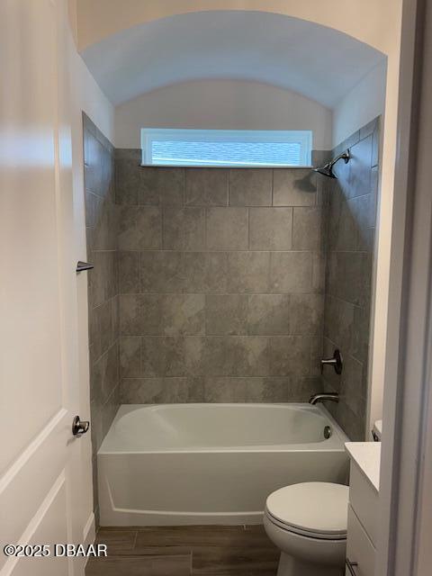 437 Aquamarine Way, Daytona Beach, FL 32124 - bathroom with plenty of natural light, vanity, shower / bathtub combination, and wood finished floors