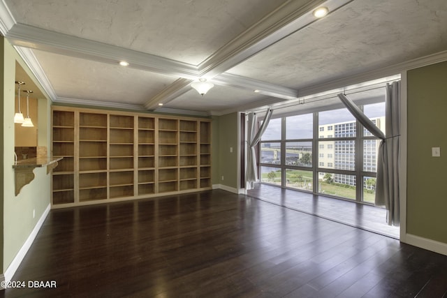 spare room featuring beam ceiling, dark hardwood / wood-style flooring, crown molding, and coffered ceiling