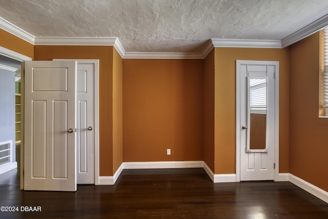 entrance foyer featuring crown molding, dark hardwood / wood-style flooring, and a textured ceiling