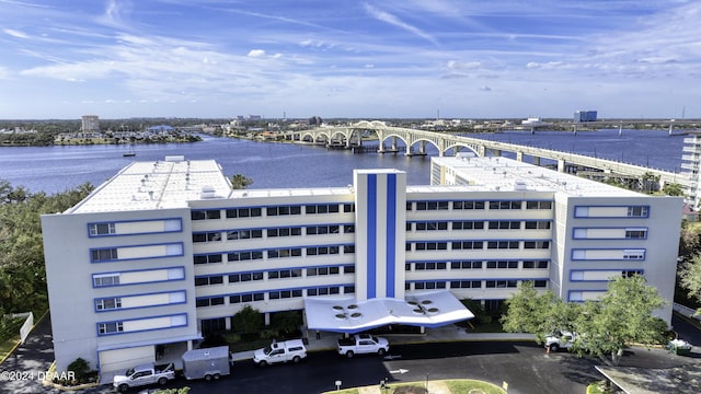 birds eye view of property with a water view