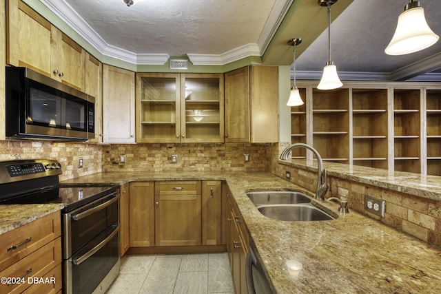 kitchen featuring light stone countertops, sink, hanging light fixtures, stainless steel appliances, and decorative backsplash