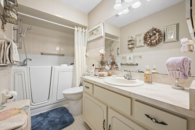 full bathroom with vanity, toilet, a textured ceiling, tile walls, and shower / tub combo with curtain