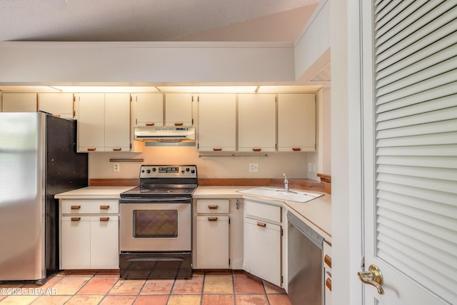 936 Meadow View Dr Unit A, Port Orange, FL 32127 - kitchen featuring appliances with stainless steel finishes, under cabinet range hood, a sink, cream cabinets, and light countertops