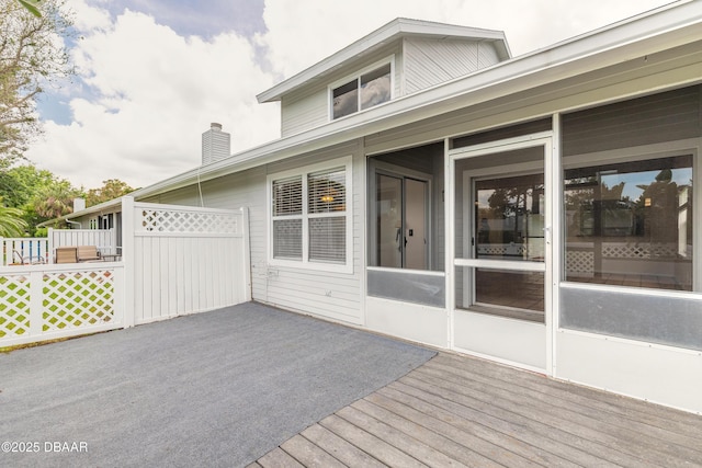936 Meadow View Dr Unit A, Port Orange, FL 32127 - wooden deck with fence and a sunroom