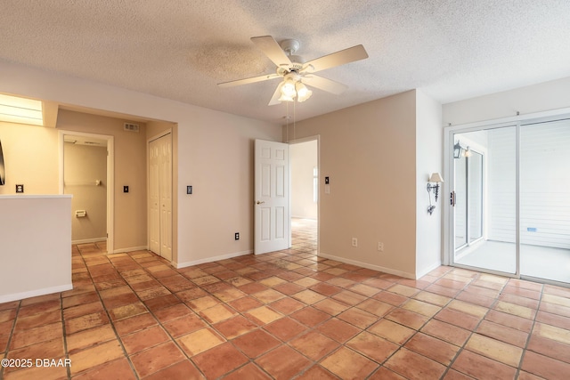 936 Meadow View Dr Unit A, Port Orange, FL 32127 - unfurnished room with ceiling fan, a textured ceiling, and baseboards