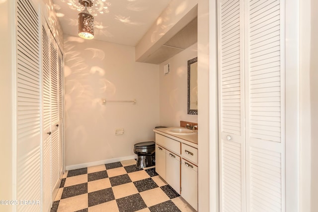 936 Meadow View Dr Unit A, Port Orange, FL 32127 - bathroom featuring a closet, tile patterned floors, vanity, baseboards, and toilet