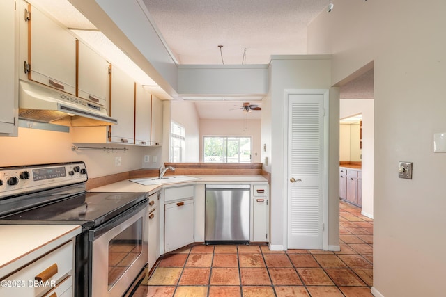 936 Meadow View Dr Unit A, Port Orange, FL 32127 - kitchen featuring appliances with stainless steel finishes, under cabinet range hood, light countertops, and a sink
