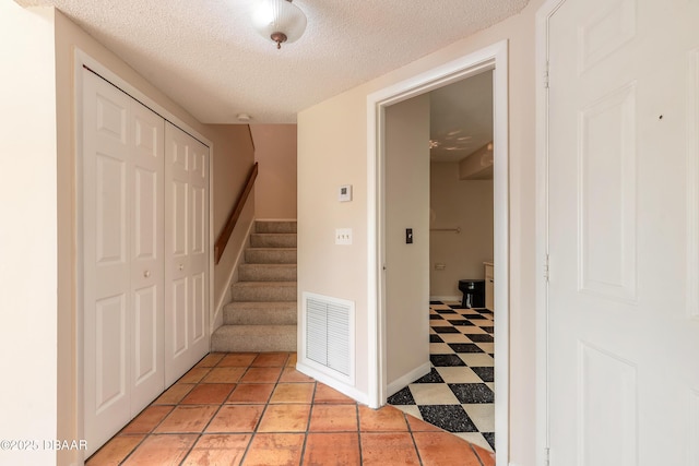 936 Meadow View Dr Unit A, Port Orange, FL 32127 - staircase featuring a textured ceiling and baseboards