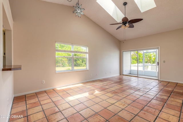 936 Meadow View Dr Unit A, Port Orange, FL 32127 - unfurnished room featuring a skylight, high vaulted ceiling, baseboards, and ceiling fan