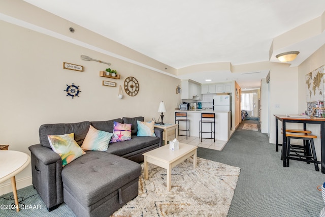 living room featuring light carpet