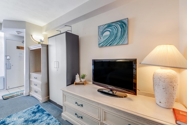 bedroom with light tile patterned floors