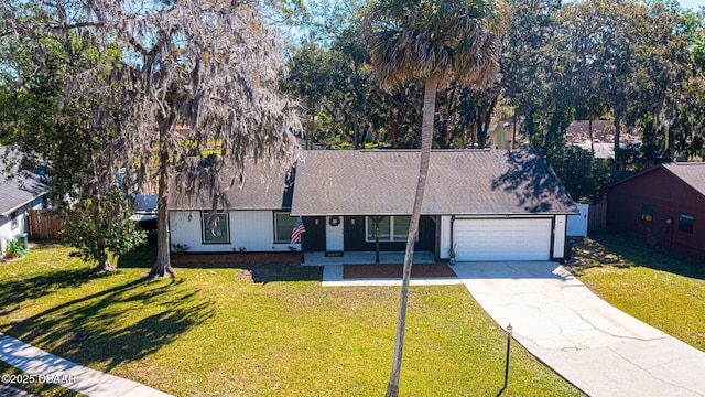 single story home with a garage, driveway, a shingled roof, fence, and a front yard