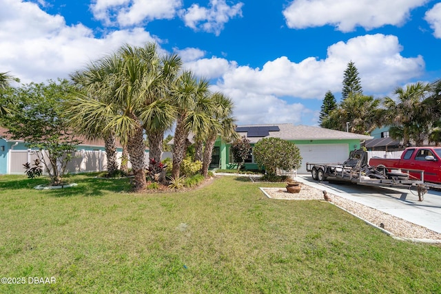 355 Palm Cir, Flagler Beach, FL 32136 - view of yard featuring an attached garage and driveway