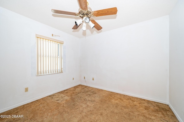 355 Palm Cir, Flagler Beach, FL 32136 - carpeted empty room with baseboards and a ceiling fan