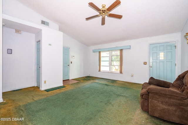 355 Palm Cir, Flagler Beach, FL 32136 - carpeted living area with lofted ceiling, a ceiling fan, and baseboards