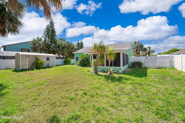 355 Palm Cir, Flagler Beach, FL 32136 - view of yard with a sunroom and a gate