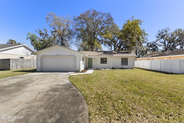 ranch-style house with driveway, a front yard, an attached garage, and fence