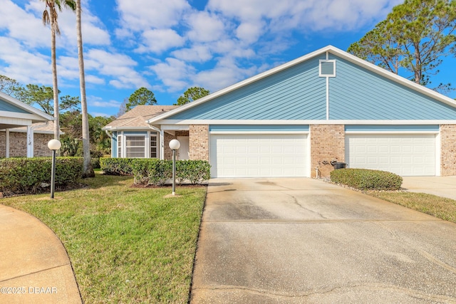 view of front of house featuring a garage and a front yard