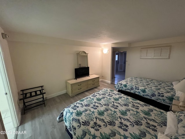 bedroom with light hardwood / wood-style floors