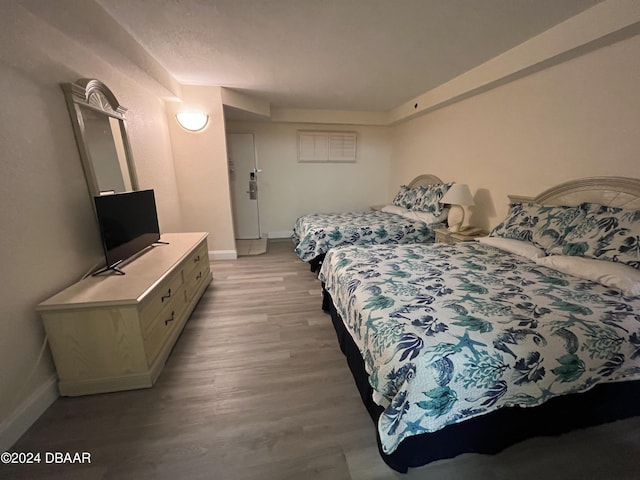 bedroom with light wood-type flooring