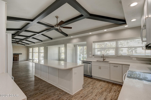 kitchen with white cabinetry, dishwasher, sink, hardwood / wood-style flooring, and coffered ceiling