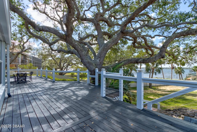 wooden deck featuring a water view