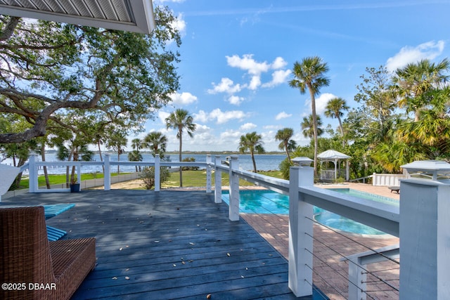 wooden terrace with a gazebo and a water view